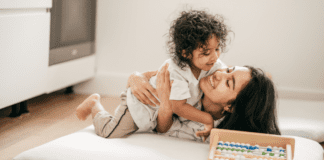 Adapting to Motherhood: Meet Cindy A mom being hugged by her son.