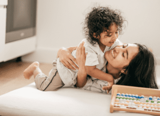 Adapting to Motherhood: Meet Cindy A mom being hugged by her son.