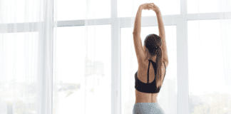 The Aches and Pains of Motherhood: Meet Jacqueline A woman stretching.