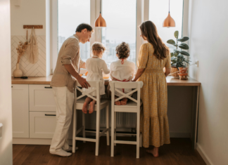 A family looking out the window.