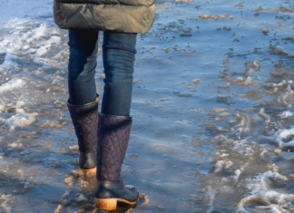 Never Looking Back: Meet Ali A woman walking through water.