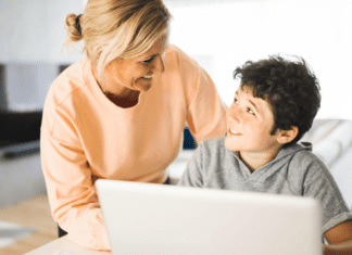 Graduating to the Next Phase of Motherhood: Meet Ruth A mom helping her son on the computer.