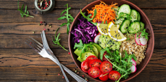 Are Vegetarian Diets Healthier? A vegetarian meal in a bowl next to a for and knife.