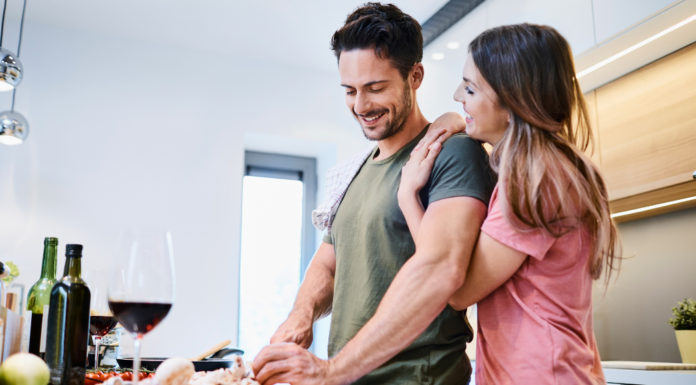 Reimagining Date Night A couple making dinner together in the kitchen.