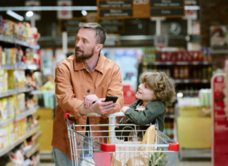 A dad with his son grocery shopping.