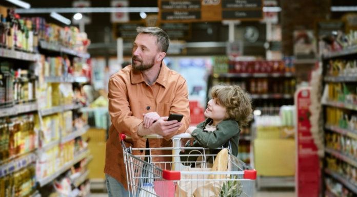 Fun and Stress-Free Grocery Shopping with Kids A dad with his son grocery shopping.
