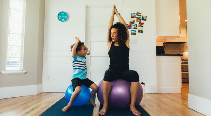 A mom exercising on balls with her son.