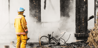 A firefighter at a house fire.