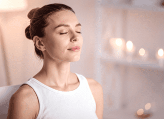 A woman meditating.