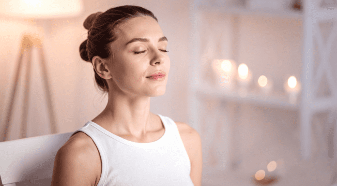 A woman meditating.