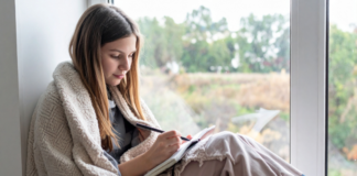 8 Ways Journaling Helps Children (and Parents) A girl writing in a journal.