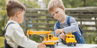 Outdoor Toys and Activities For All Ages Under $50 Boys playing outside with trucks.