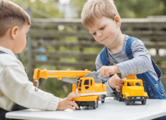 Outdoor Toys and Activities For All Ages Under $50 Boys playing outside with trucks.