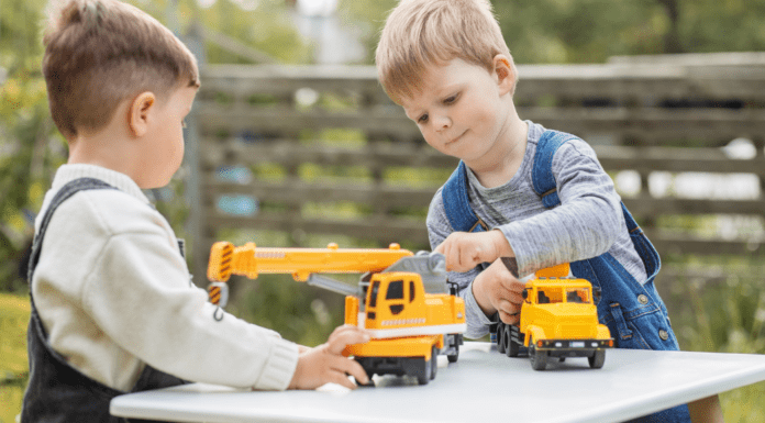 Outdoor Toys and Activities For All Ages Under $50 Boys playing outside with trucks.