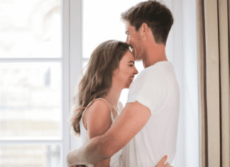 Man and woman embracing.