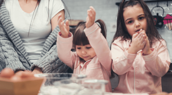 Do I Have a Favorite Child? Two girls baking with a woman.