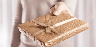 The Gift that Won’t Break: Books! Woman holding a wrapped book.