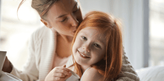 I Think I’m Done A mom kissing her daughter's head.