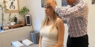 A Natural Solution to Pregnancy Aches and Pains A pregnant woman with a chiropractor.