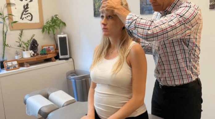 A pregnant woman with a chiropractor.