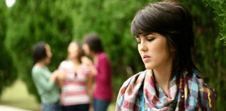 A woman left out of a group.