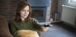 Rom-Com & Romance Await for Your Valentine’s Day Celebration! A woman watching a movie.