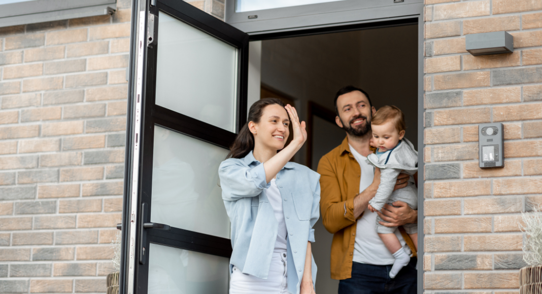 A family waving goodbye.
