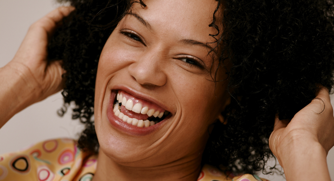 A woman laughing.