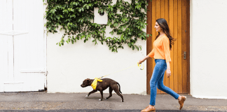 A woman walking her dog.