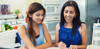 A mother and daughter working on a college application.