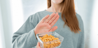 What I Wish People Knew About Food Allergies A woman saying no to peanuts.