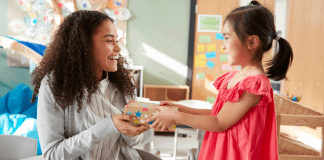 A child giving a teacher