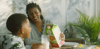 At the Corner of Motherhood and a Farm A mom pouring a glass of Organic Valley milk.