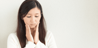 The Anxious Mom: Using Creativity to Help Combat Anxiety An anxious mom holding her face.