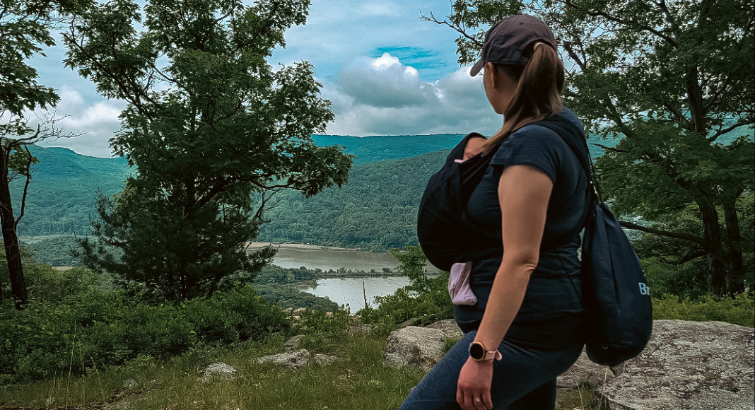 A mom hiking with a baby carrier.