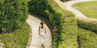 A woman walking through a maze.