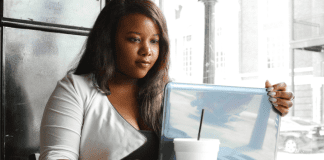 A woman Googling information.