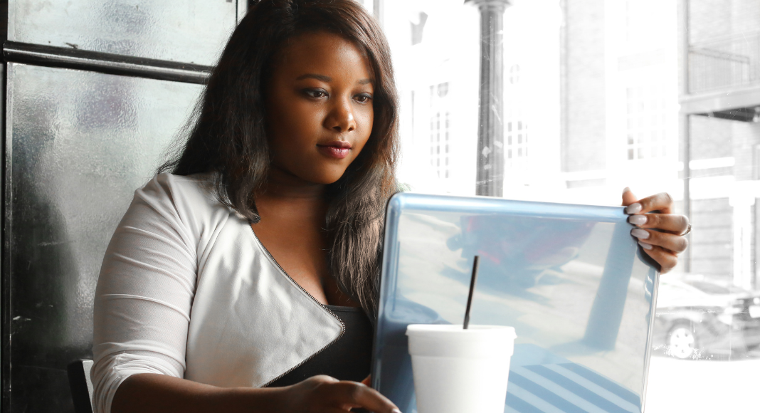 A woman Googling information.