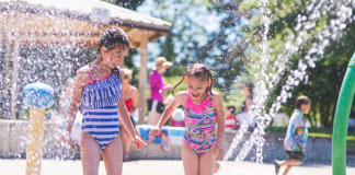 Girls playing in a local splash pad.