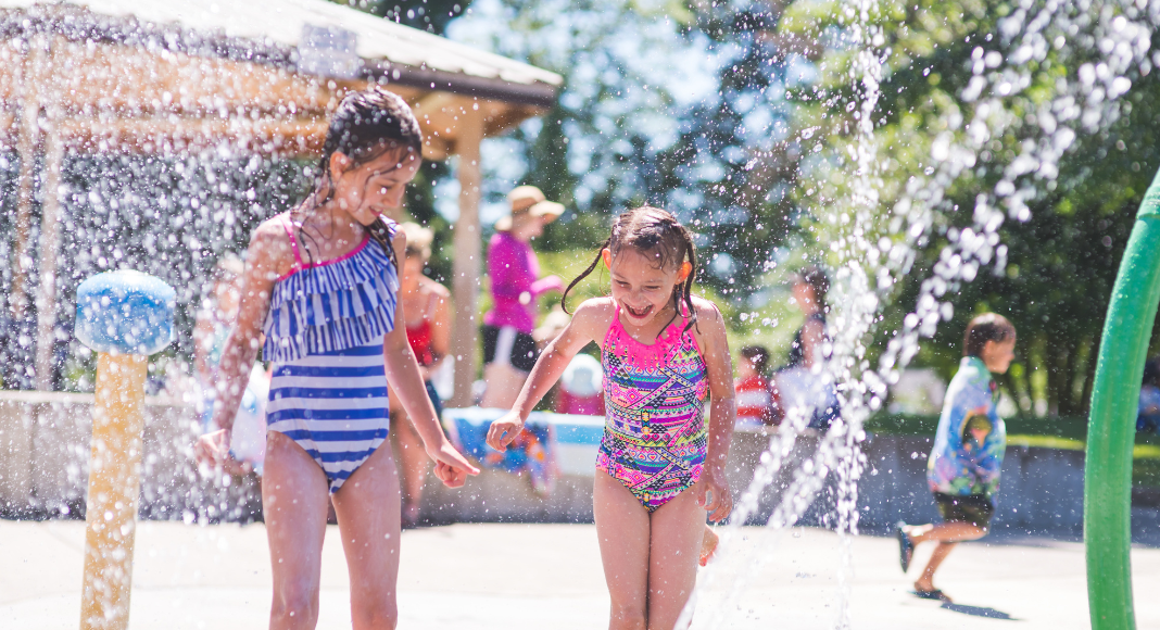 Girls playing in a local splash pad.