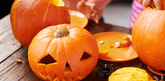 Carving a pumpkin.