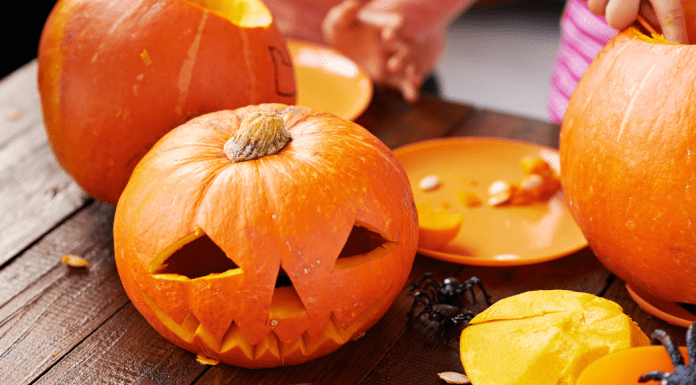Carving a pumpkin.