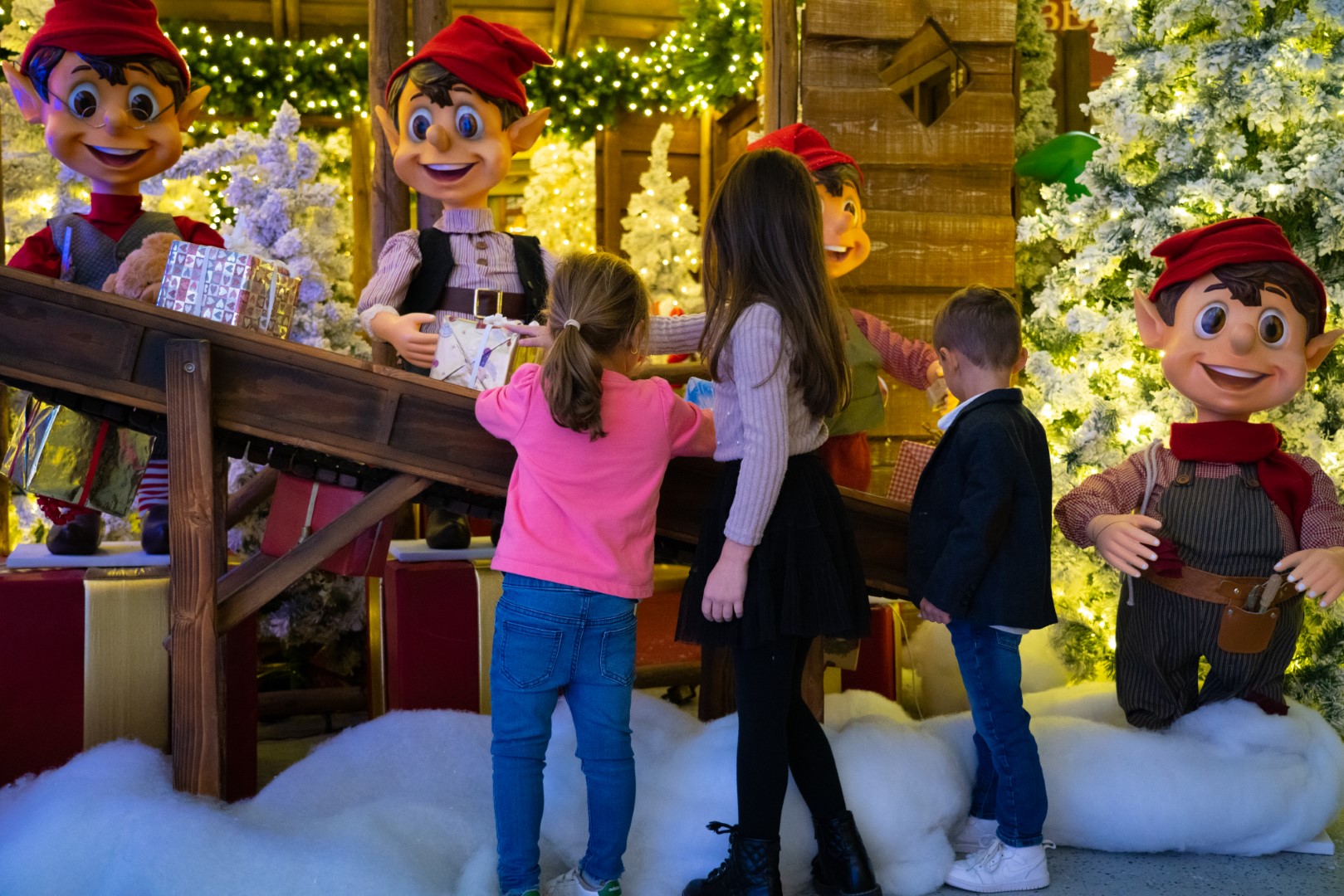 Children looking at a Christmas display.
