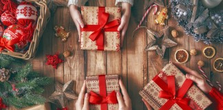 Holiday gifts wrapped in red bows.