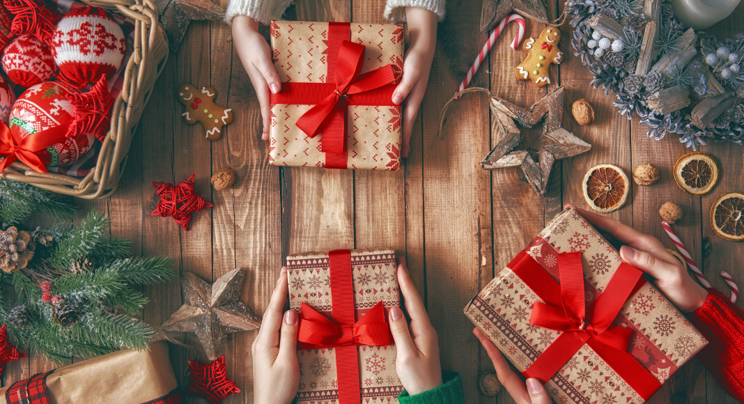 Holiday gifts wrapped in red bows.
