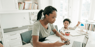 A mom working next to her son.