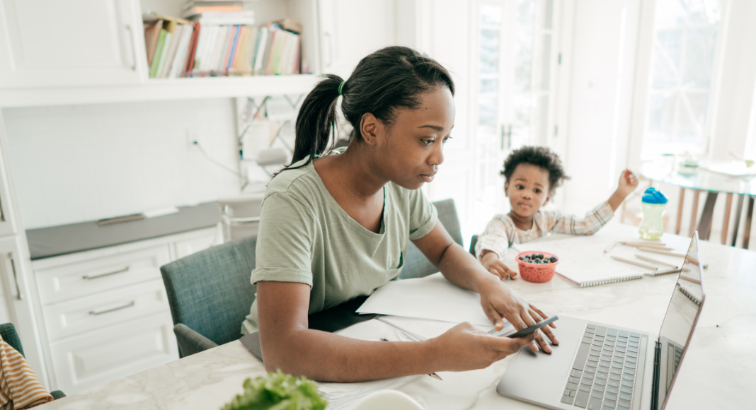 A mom working next to her son.