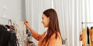 Mom Approved Style Tips for a More Stylish New Year A woman looking at a New Year's Eve dress.