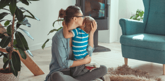 A mother hugging her son.
