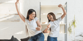 What Your ‘Spotify Wrapped’ Says About Your Parenting Style Mom and daughter dancing.